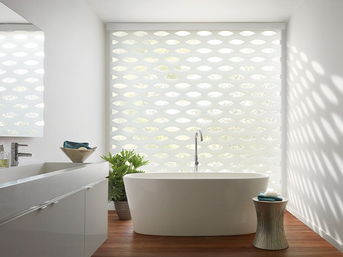 white bath tub with large window behind