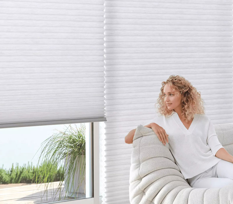 woman staring out window